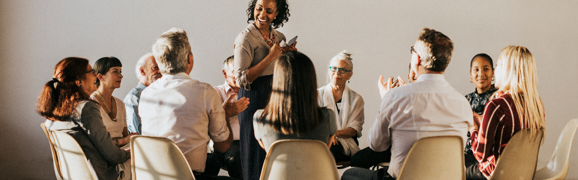 Diverse group of professionals in an engaged roundtable discussion representing future-casting strategy sessions for pharma market research and strategic foresight