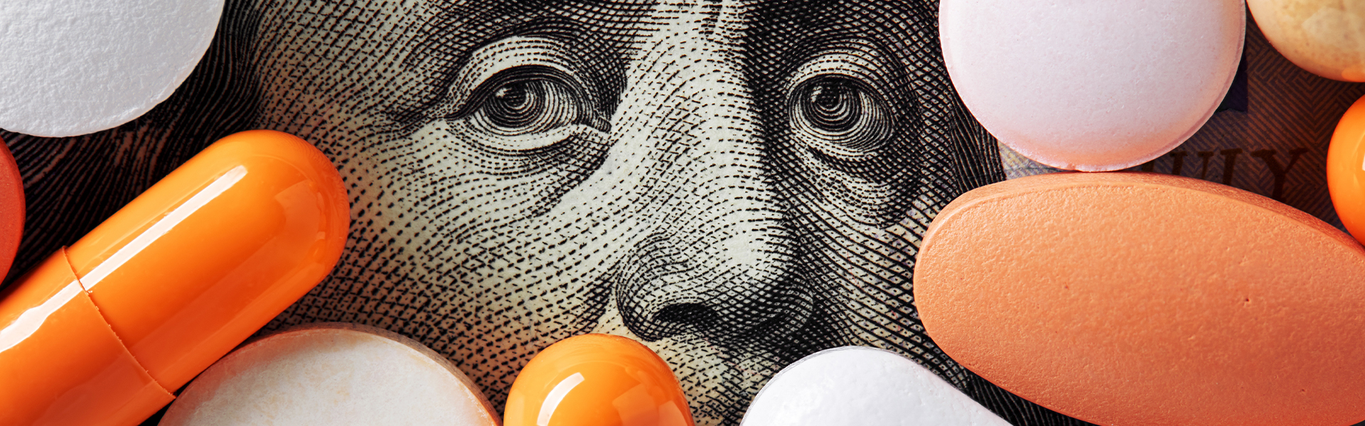 Prescription medications overlaid on US currency representing the financial pressure of reimbursement changes reshaping medical practice economics in pharma